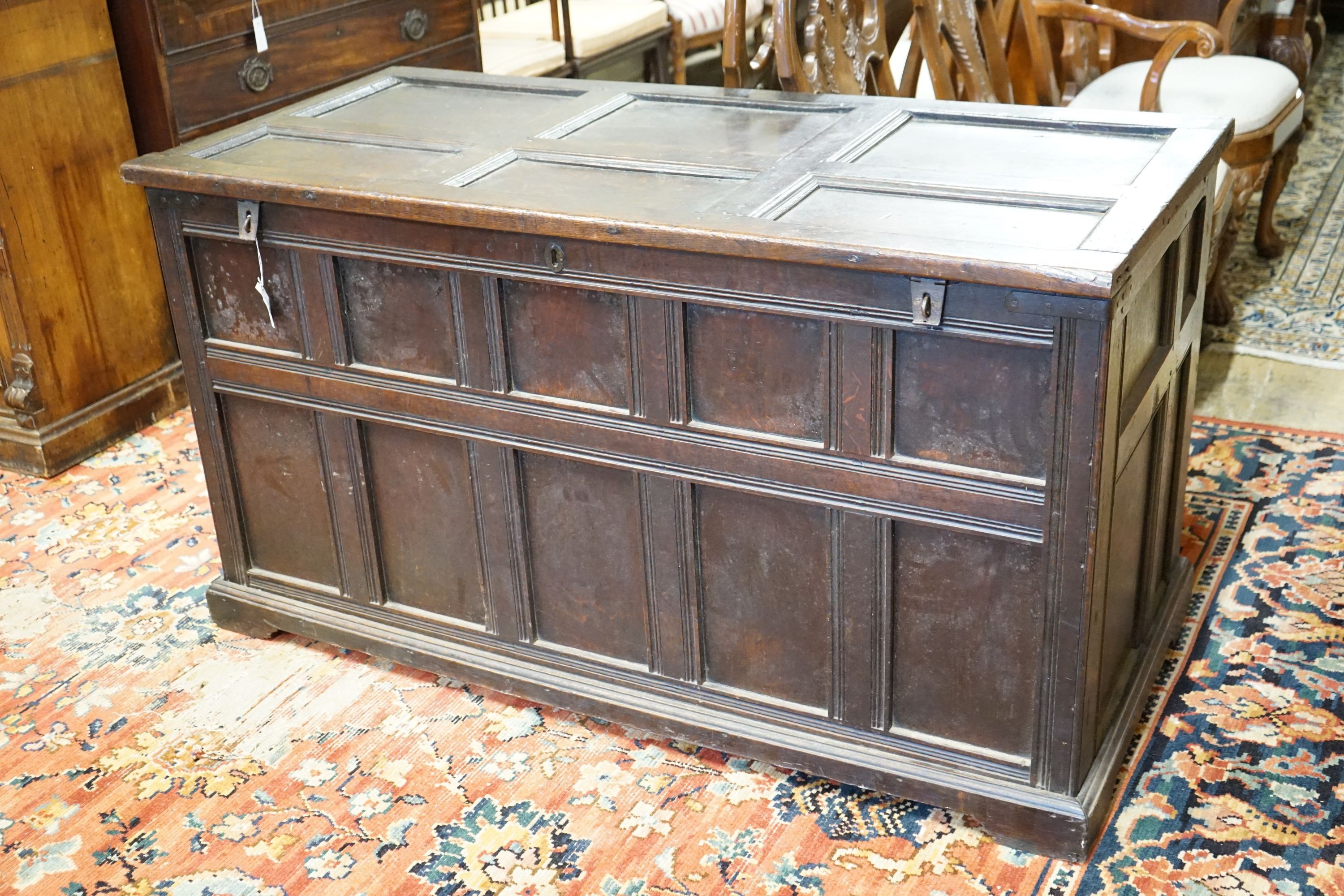 An 18th century panelled oak coffer, length 147cm, depth 67cm, height 80cm